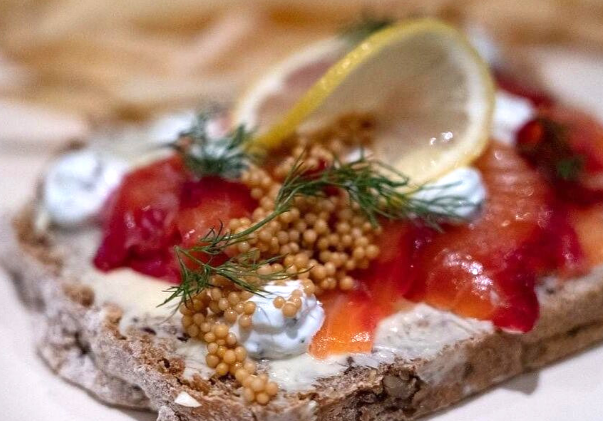 fish, bread, caviar, lemon, on a plate